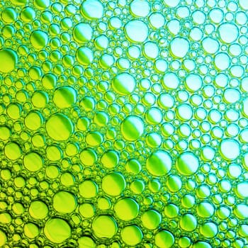 Green bubbles background. Foam bubbles macro texture.