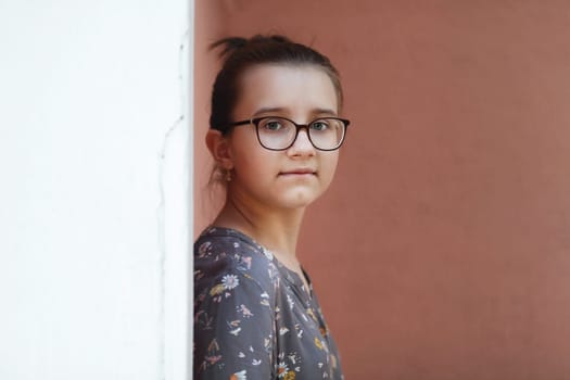 Close up portrait of teenage girl wearing glasses. Selective focus.