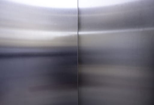 Shiny steel background detail, new elevator door
