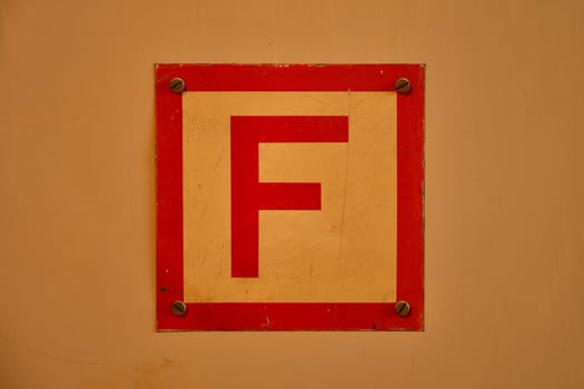 sign for a box with a fire hose in a house
