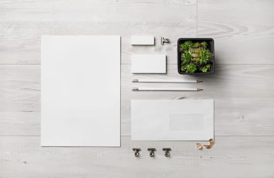 Blank stationery set. Business brand template on wooden background. Top view. Flat lay.