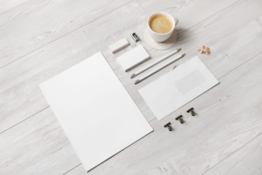 Blank stationery and corporate identity template on wood background. Responsive design mockup.