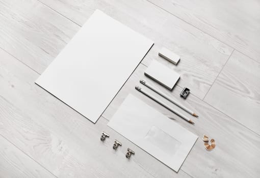 Blank stationery set and corporate identity template on wooden background. For design presentations and portfolios.