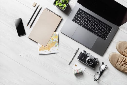 Travel vacation accessories and laptop. Ready for trip. Flat lay.
