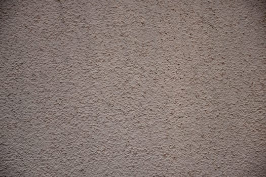 Wall of concrete with pink plastering