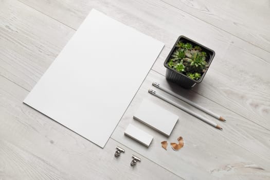 Blank business stationery set on wooden background.