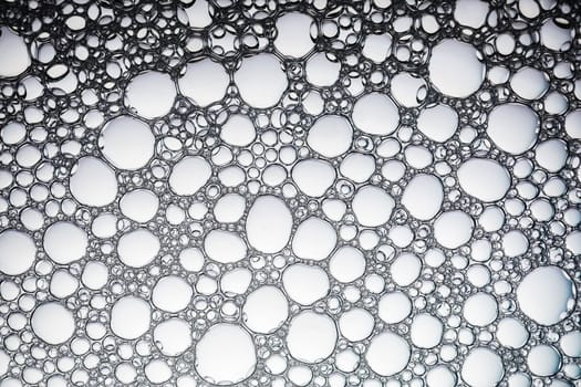 Soapsuds bubbles as background. Water background with bubbles. Flat lay.