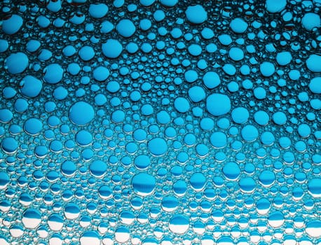 Blue bubbles background. Foam bubbles macro texture.