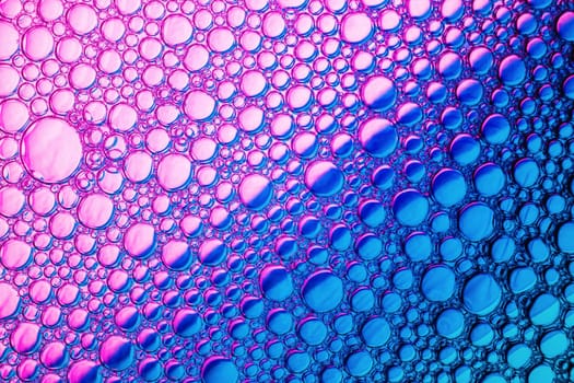 Bubbles on blue and purple background. Bubbles texture.