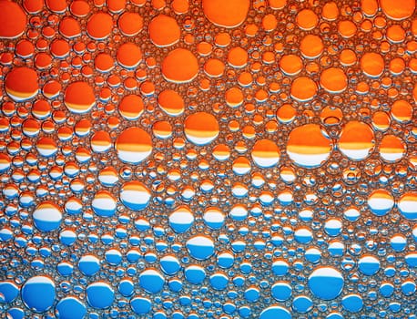 Orange and blue bubbles background. Foam bubbles macro texture.