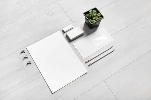 Blank branding stationery set on wooden background. Corporate identity mockup.