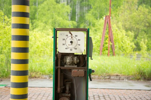 an old abandoned gas station far from the road.
