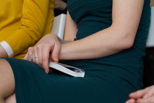 Portrait of a confident woman holding a notebook and pen in her hands