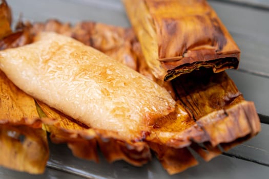 Thai traditional dessert. Grilled Taro Stuffed Coconut Sticky Rice