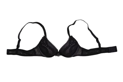 Bra isolated. Closeup of beautiful female stylish black bra with laces and straps isolated on a white background. Fashionable women underwear.
