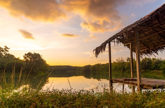 View of Colorful dramatic sky sunset or sunrise with clouds background on Water River in Forest, Sky with cloud in nature and travel concept.