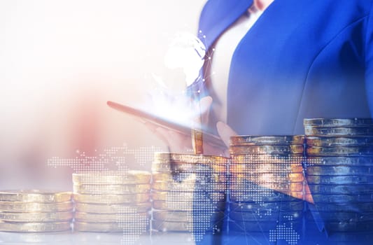 Double exposure online banking and internet banking and people networking account banking finance concept, Business women with laptop, phone, cellphone, tablet, smartphone mobile, and coin money on business office table