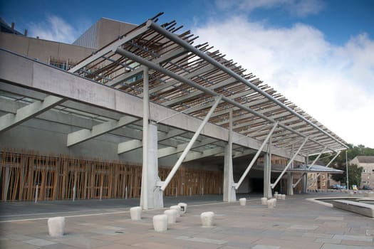 The Scottish Parliament building in Edinburgh with blue sky