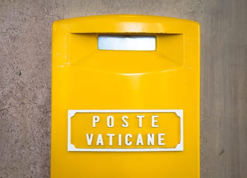 ROME, VATICAN STATE - AUGUST 19, 2018: Detail of the traditional yellow post box in Vatican City, Rome