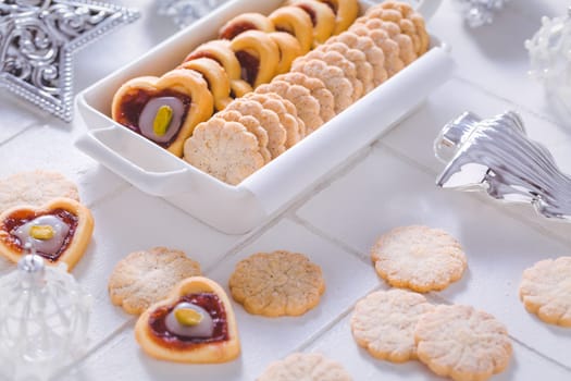 Homemade Christmas cookies with ornaments in white
