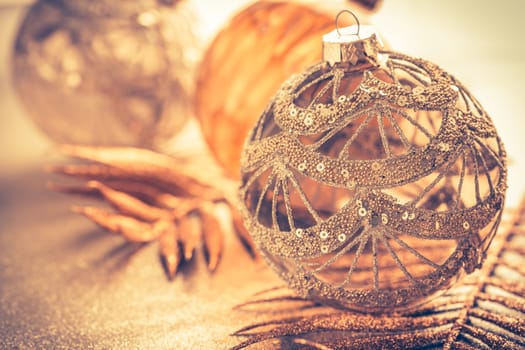 Christmas ornaments in golden tones