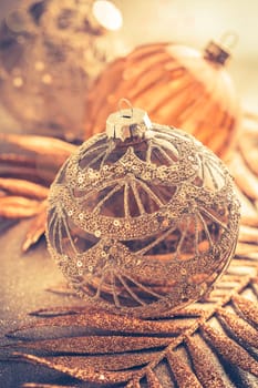 Christmas ornaments in golden tones