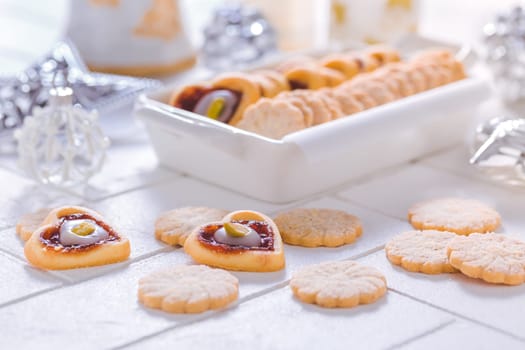 Homemade Christmas cookies with ornaments in white
