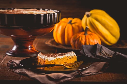 Homemade pumpkin pie with icing for Thanksgiving