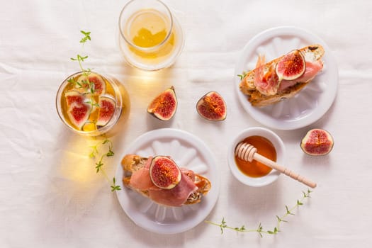 Small canape snack, crostini with ham, fig and apple wine, Italian antipasti