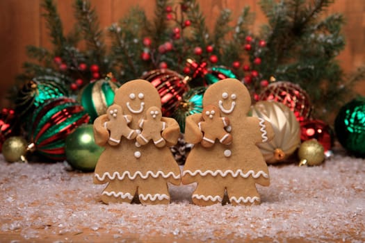 Gingerbread Family of 3 kids on Holiday Christmas Background