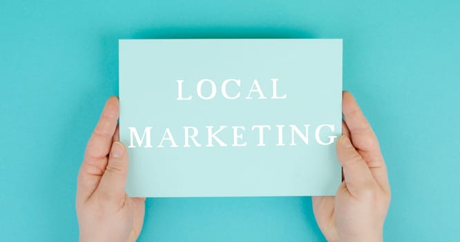 Local marketing, support small businesses, enviromental shopping, text on paper,blue background