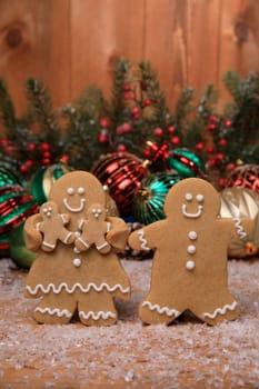 Gingerbread Family of 2 kids on Holiday Christmas Background