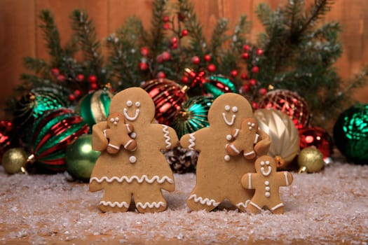 Gingerbread Family of 3 kids on Holiday Christmas Background