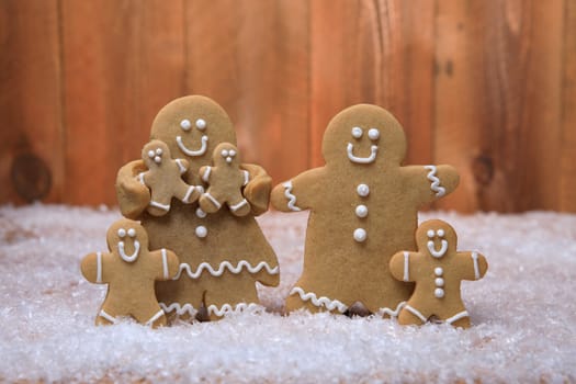 Gingerbread Family of 4 kids on Holiday Christmas Background