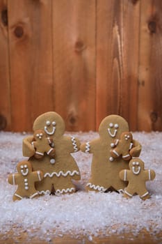 Gingerbread Family of 4 kids on Holiday Christmas Background