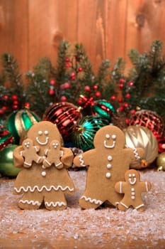 Gingerbread Family of 3 kids on Holiday Christmas Background