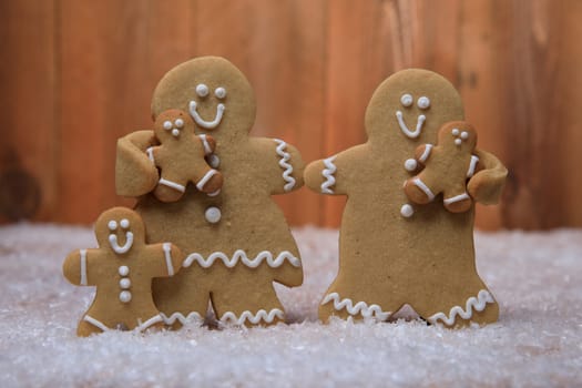 Gingerbread Family of 3 kids on Holiday Christmas Background