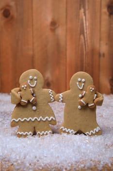 Gingerbread Family of 2 kids on Holiday Christmas Background