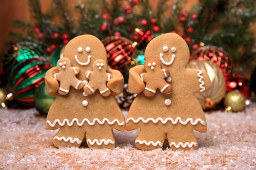 Gingerbread Family of 3 kids on Holiday Christmas Background