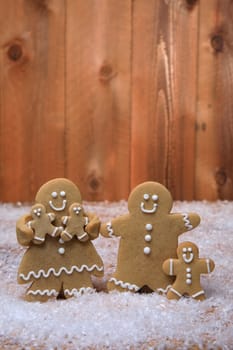 Gingerbread Family of 3 kids on Holiday Christmas Background