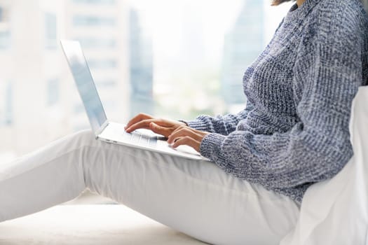 Woman using laptop computer, New lifestyle of people using laptop computers to work from anywhere