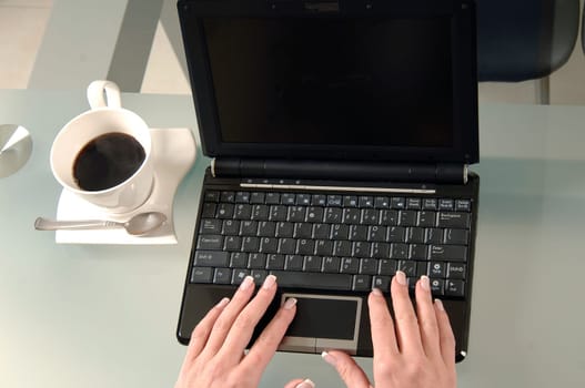 the woman is typing on the computer