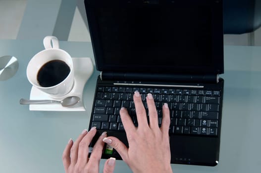 the woman is typing on the computer