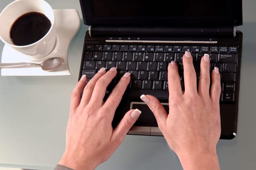 the woman is typing on the computer