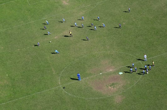 Children train football on a large football field in Velika Gorica, Croatia