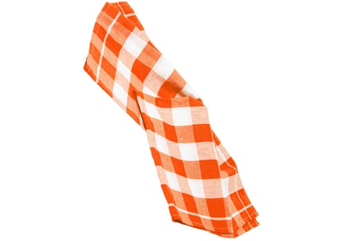 Closeup of a orange and white checkered napkin or tablecloth texture isolated on a white background. Kitchen accessories.