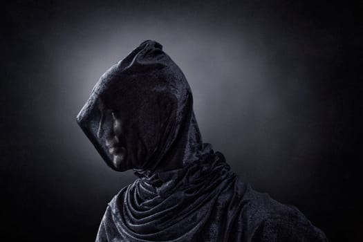 Creepy figure over dark misty background