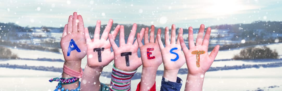 Children Hands Building Colorful German Word Attest Means Attestation. Snowy Winter Background With Snowflakes