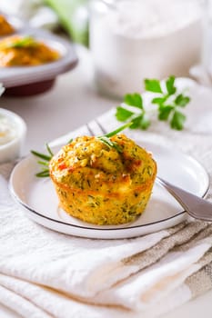 Homemade zucchini muffins with feta cheese, savory courgette with ingredients