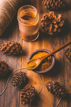 Gingerbread spice mix and seasoning for gingerbread cookies for Christmas on wooden background
